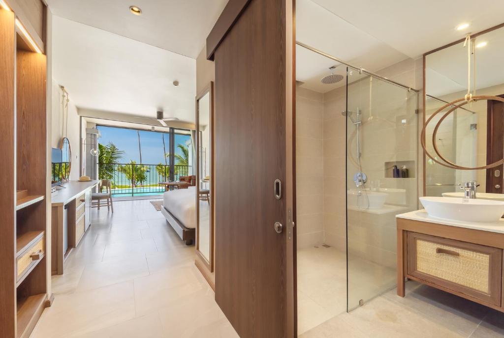 a bathroom with a shower and a sink and a tub at The Culture Samui in Bangrak Beach