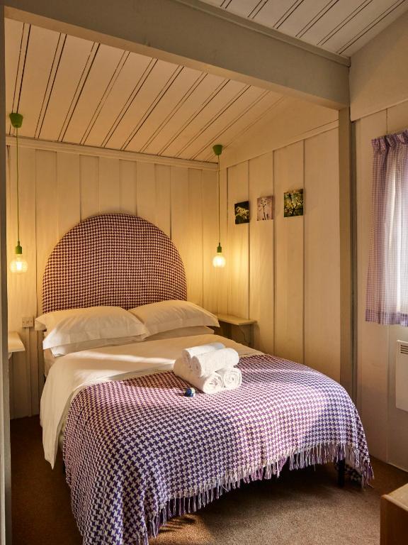 Postel nebo postele na pokoji v ubytování Lochend Chalets