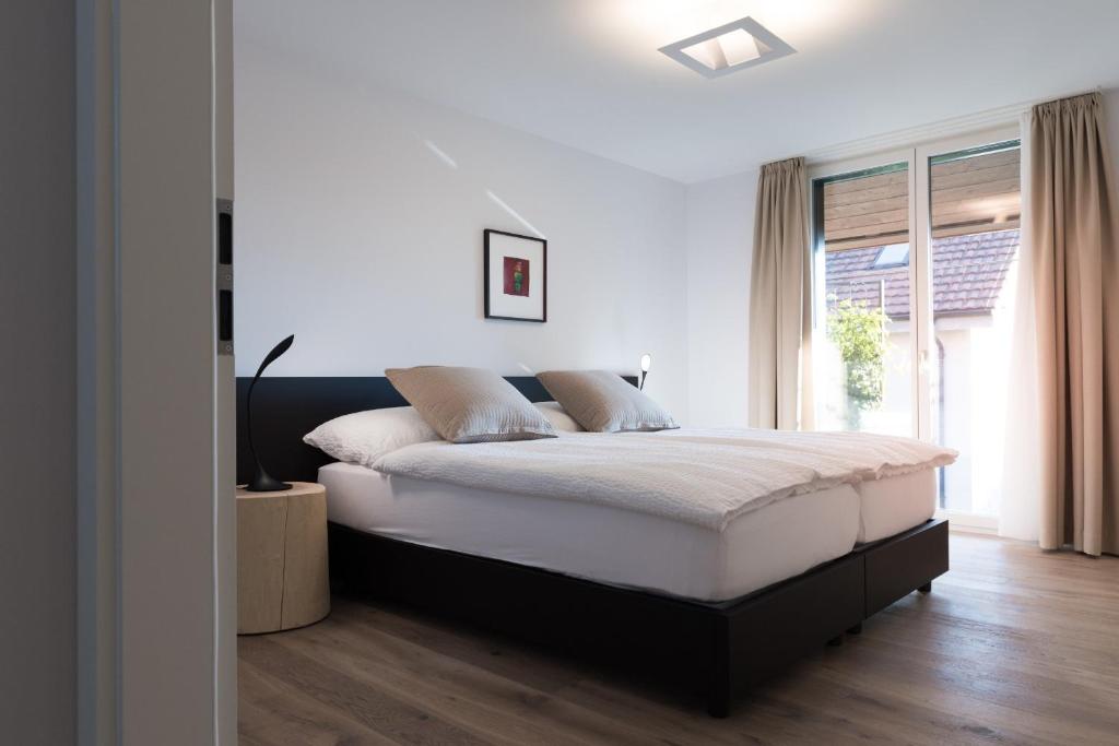 Voodi või voodid majutusasutuse Hôtel la Croix Blanche toas