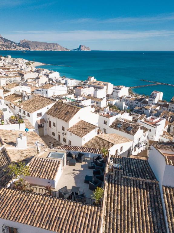 an aerial view of a town with white buildings and the ocean at Porta Nova Suites - Room Breakfast & Sea View in Altea