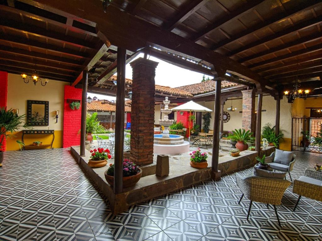 a living room with a pavilion with plants and a fountain at Casa Vieja in Mazamitla