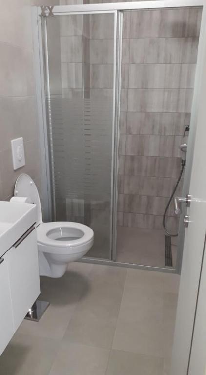 Kúpeľňa v ubytovaní Apartament Wioletta Ciovo Okrug Gornji