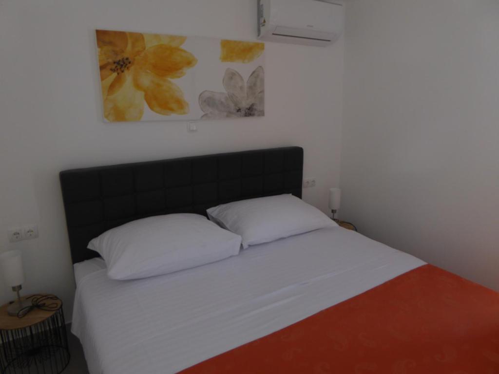 Posteľ alebo postele v izbe v ubytovaní Apartament Wioletta Ciovo Okrug Gornji