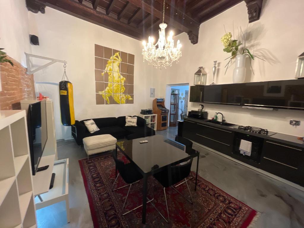 a living room with a table and a couch at Luxury Apartament Florence in Florence