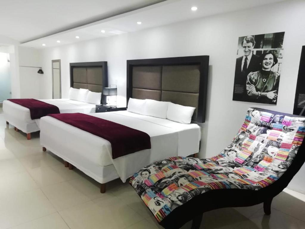 Postel nebo postele na pokoji v ubytování MayaFair Design Hotel