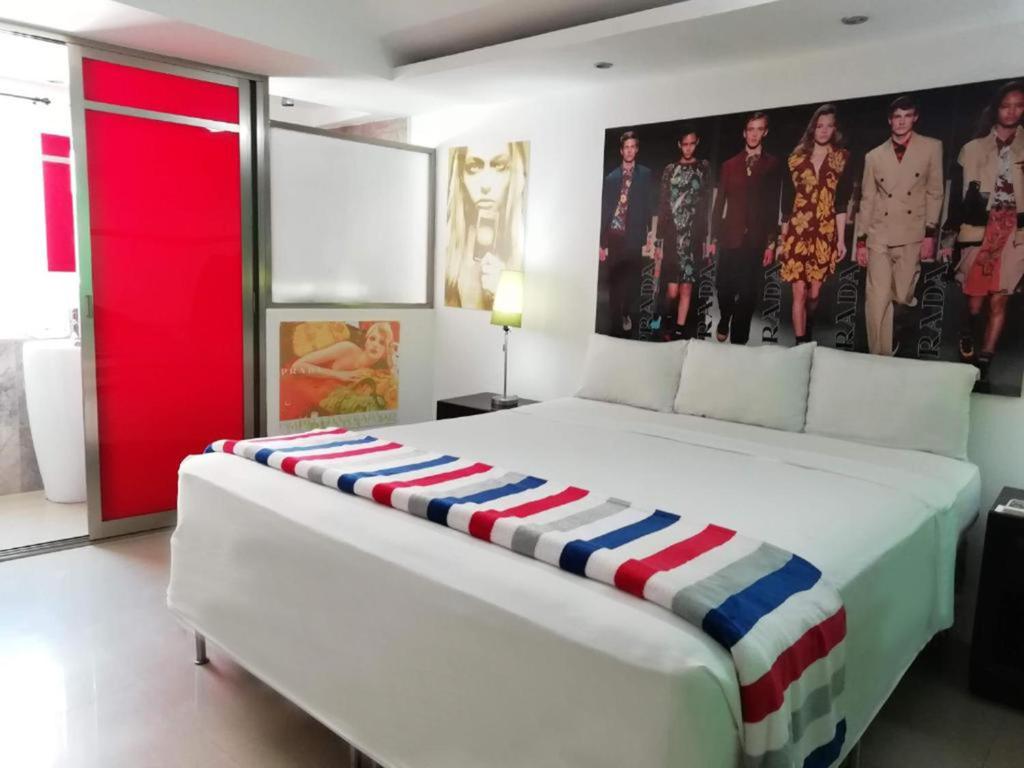 Postel nebo postele na pokoji v ubytování MayaFair Design Hotel