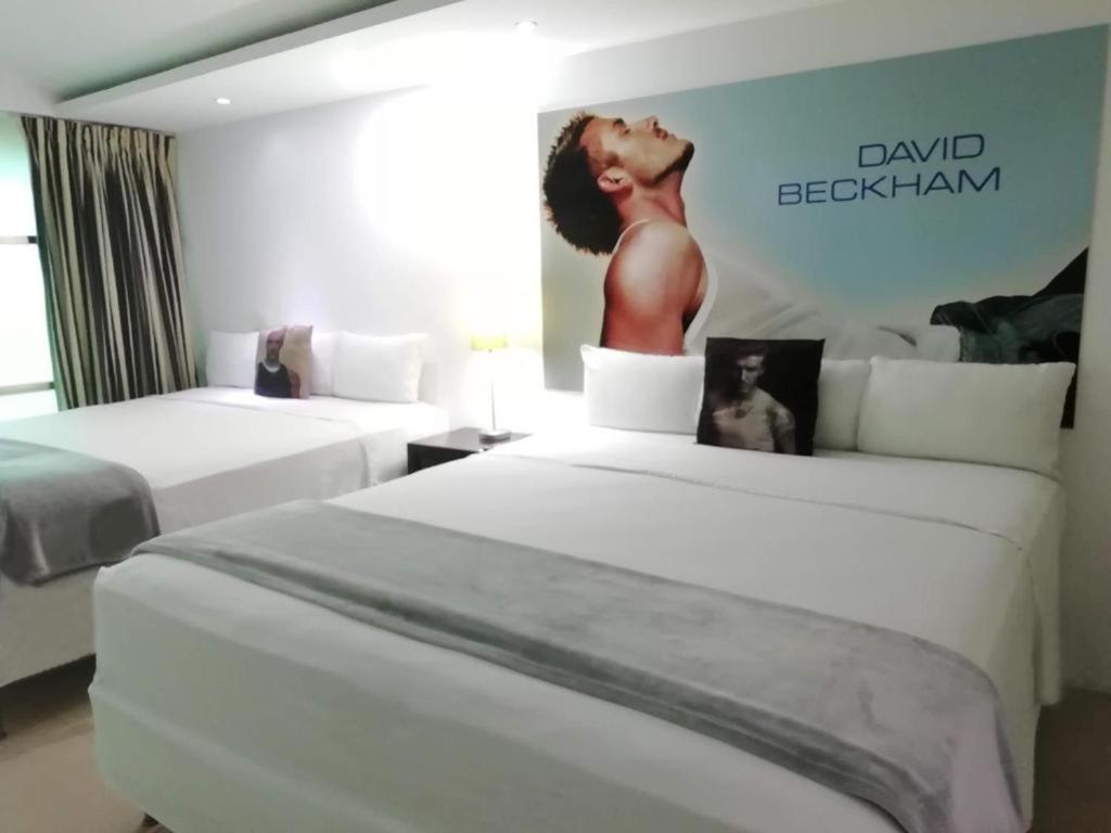 Postel nebo postele na pokoji v ubytování MayaFair Design Hotel