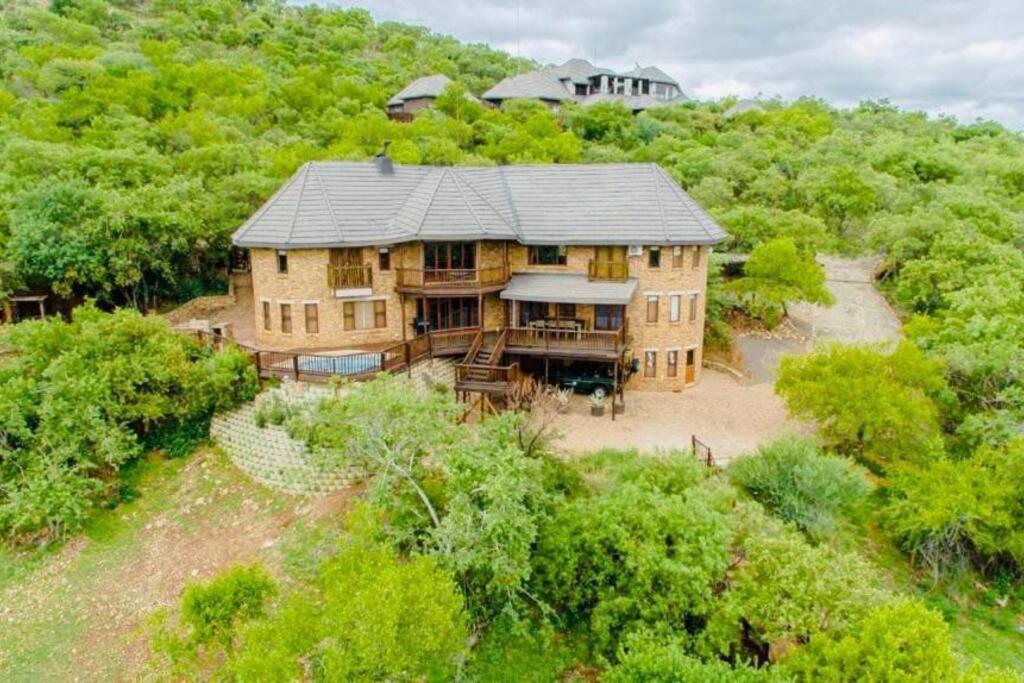 an aerial view of a large house in the woods at Boabab Lodge in Mabula
