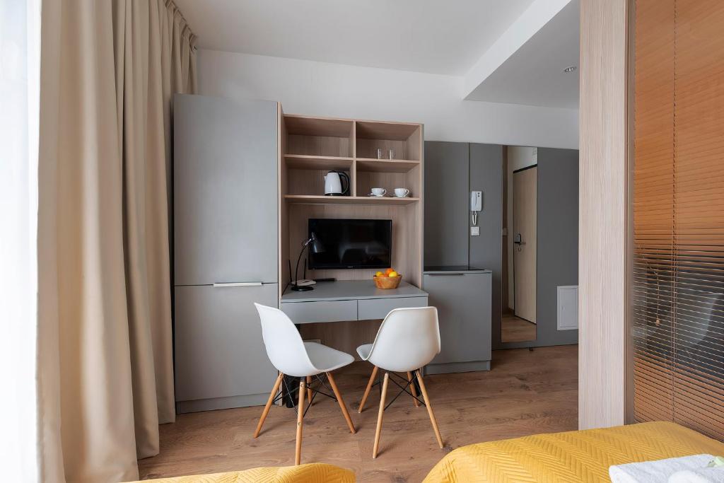 Televízia a/alebo spoločenská miestnosť v ubytovaní Aparthotel City Break Wolska