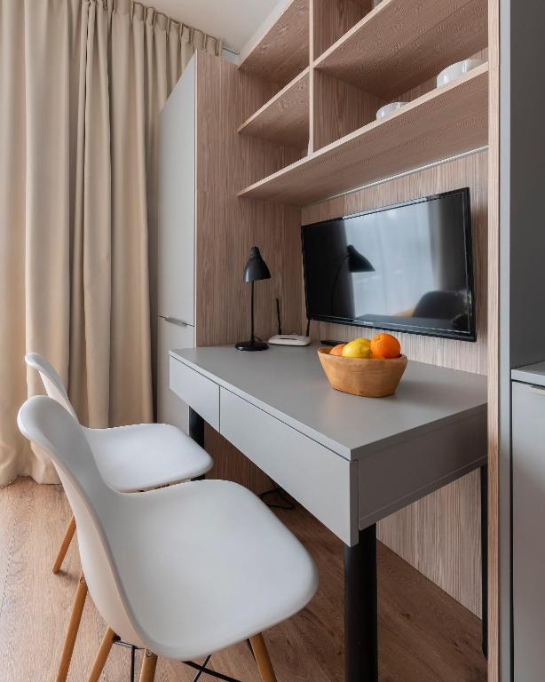 Televízia a/alebo spoločenská miestnosť v ubytovaní Aparthotel City Break Wolska