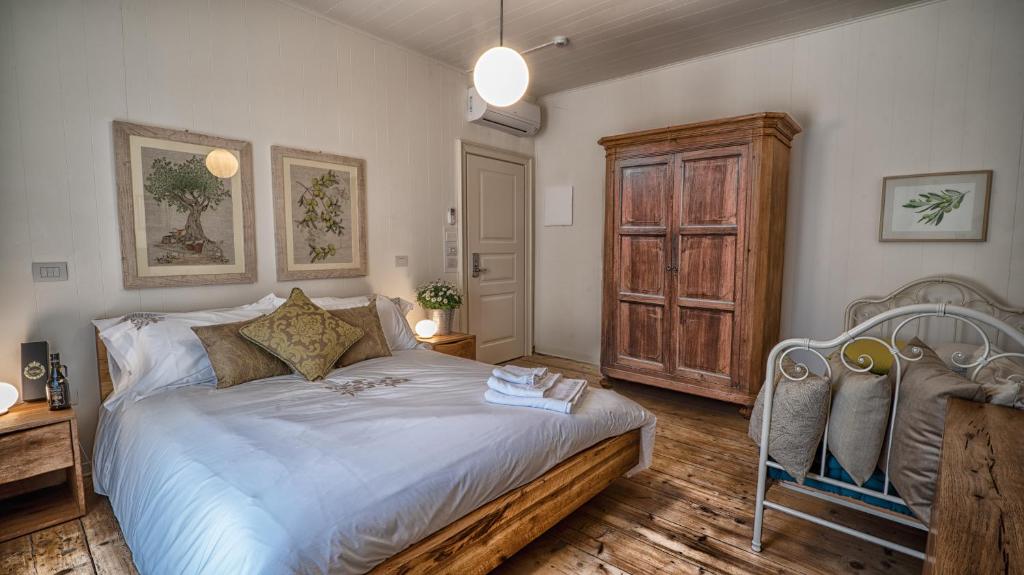 Postel nebo postele na pokoji v ubytování Locanda Dell'Oleificio