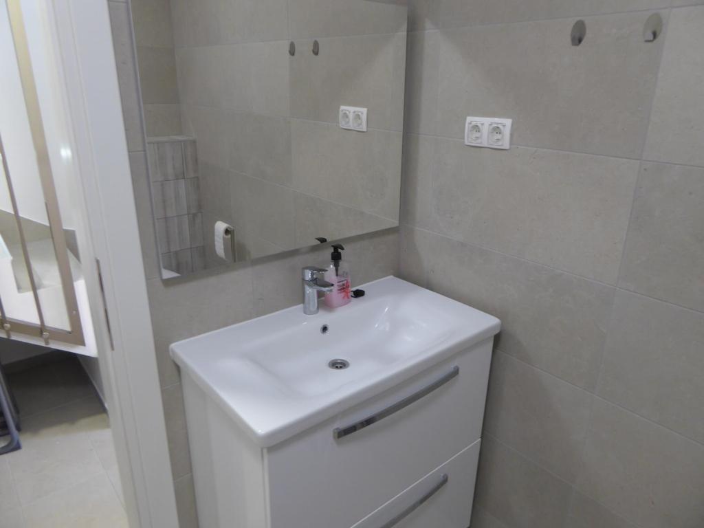 Kúpeľňa v ubytovaní Apartament Wioletta Ciovo Okrug Gornji