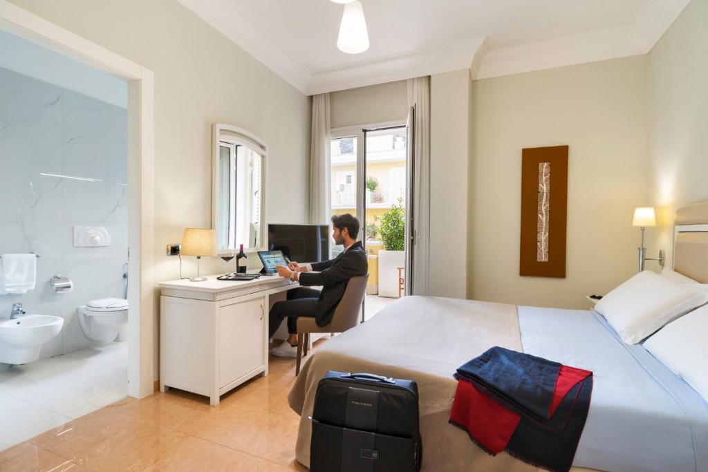 Postel nebo postele na pokoji v ubytování Victoria Palace Hotel & Zen Wellness