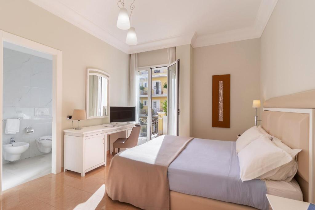 Postel nebo postele na pokoji v ubytování Victoria Palace Hotel & Zen Wellness