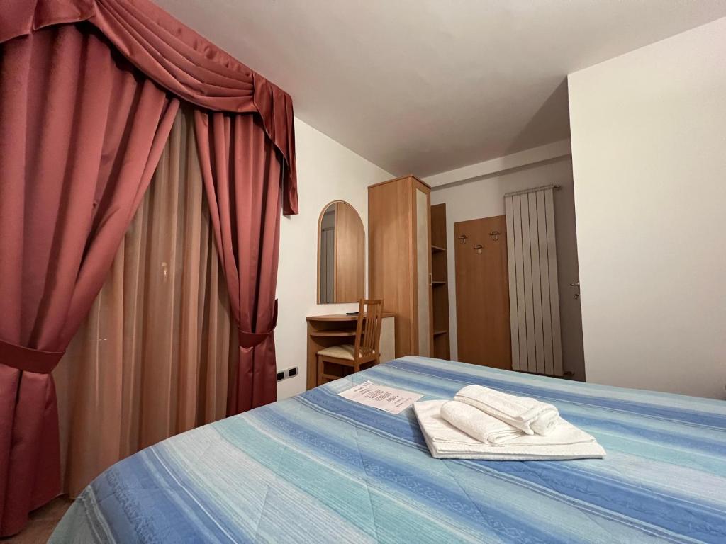 Łóżko lub łóżka w pokoju w obiekcie Casa Hotel Civitella