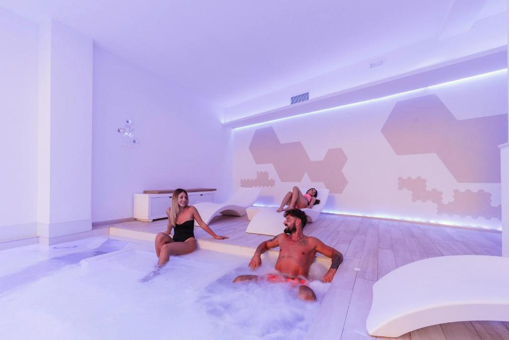 Postel nebo postele na pokoji v ubytování Victoria Palace Hotel & Zen Wellness