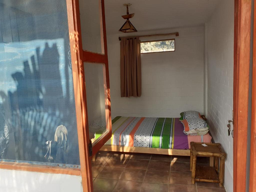 Postel nebo postele na pokoji v ubytování Casa Máncora Guesthouse