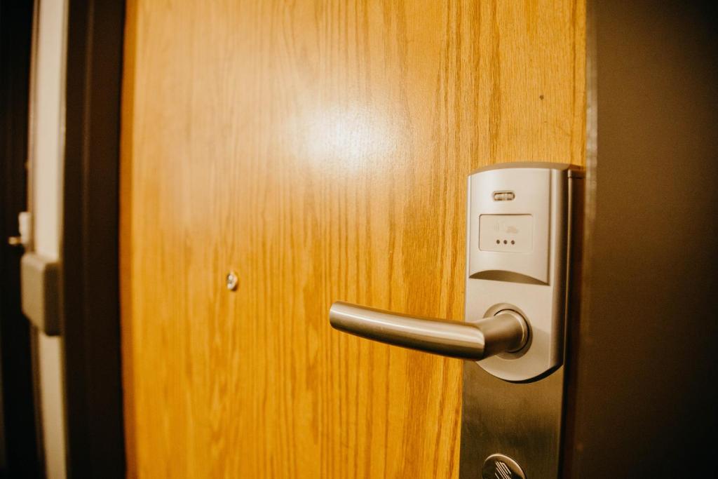 a close up of a door with a metal handle at Super 8 by Wyndham Revelstoke BC in Revelstoke