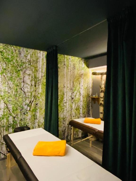 A bed or beds in a room at Ethno Houses Plitvice Lakes Hotel