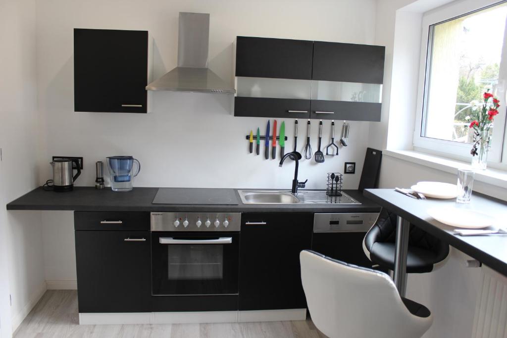 Kuchyňa alebo kuchynka v ubytovaní Apartamenty Artur