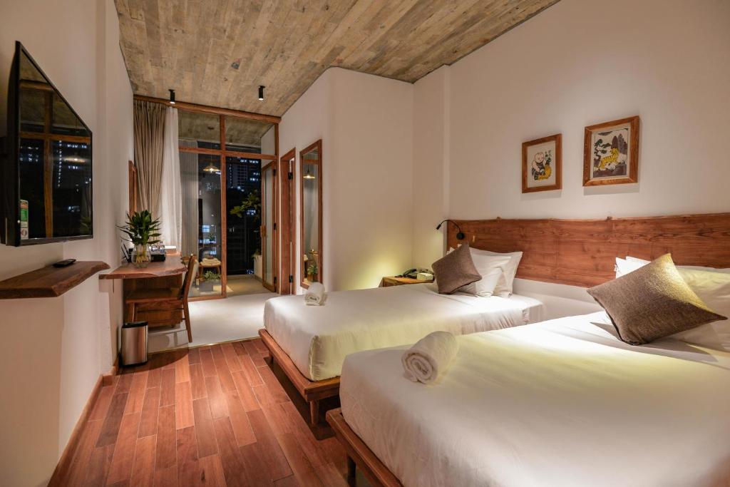 Postel nebo postele na pokoji v ubytování 22Land Hotel & Residence