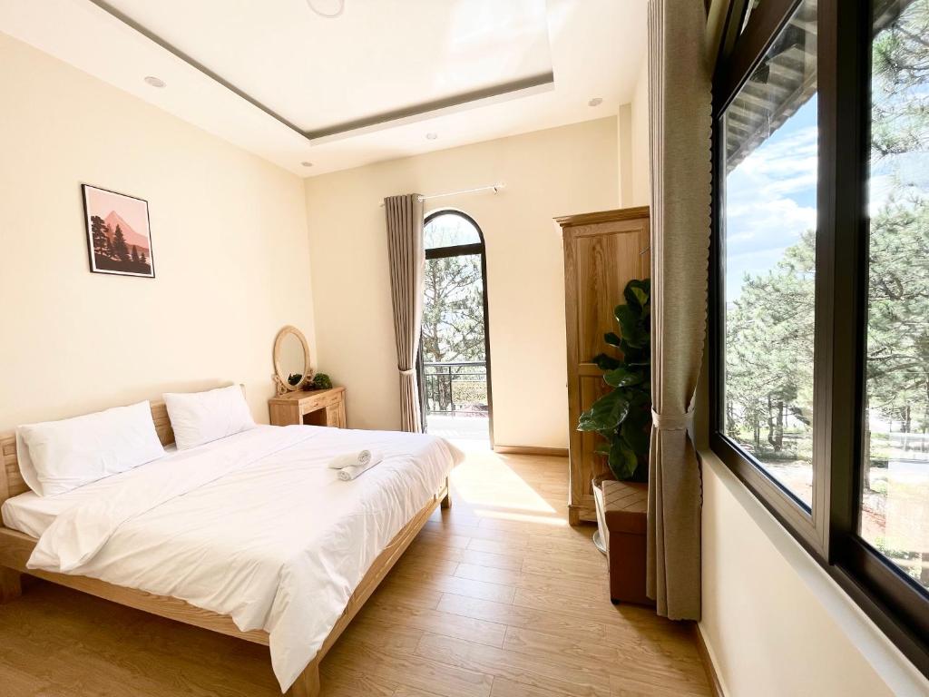 Giường trong phòng chung tại Gia An - hotel in Dalat