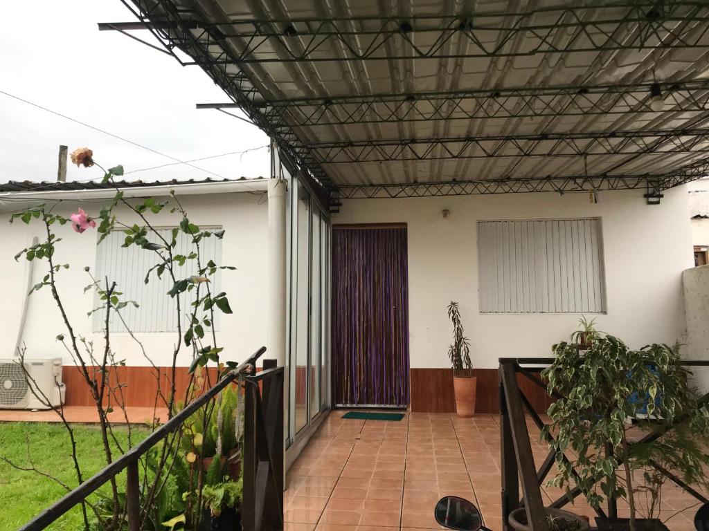 an external view of a house with a patio at Confortable espacio en Minas in Minas