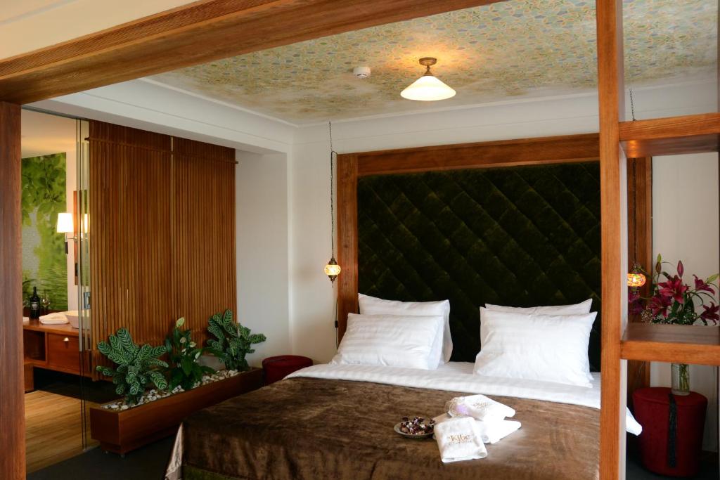 Postel nebo postele na pokoji v ubytování Rooms Kibe Mahala