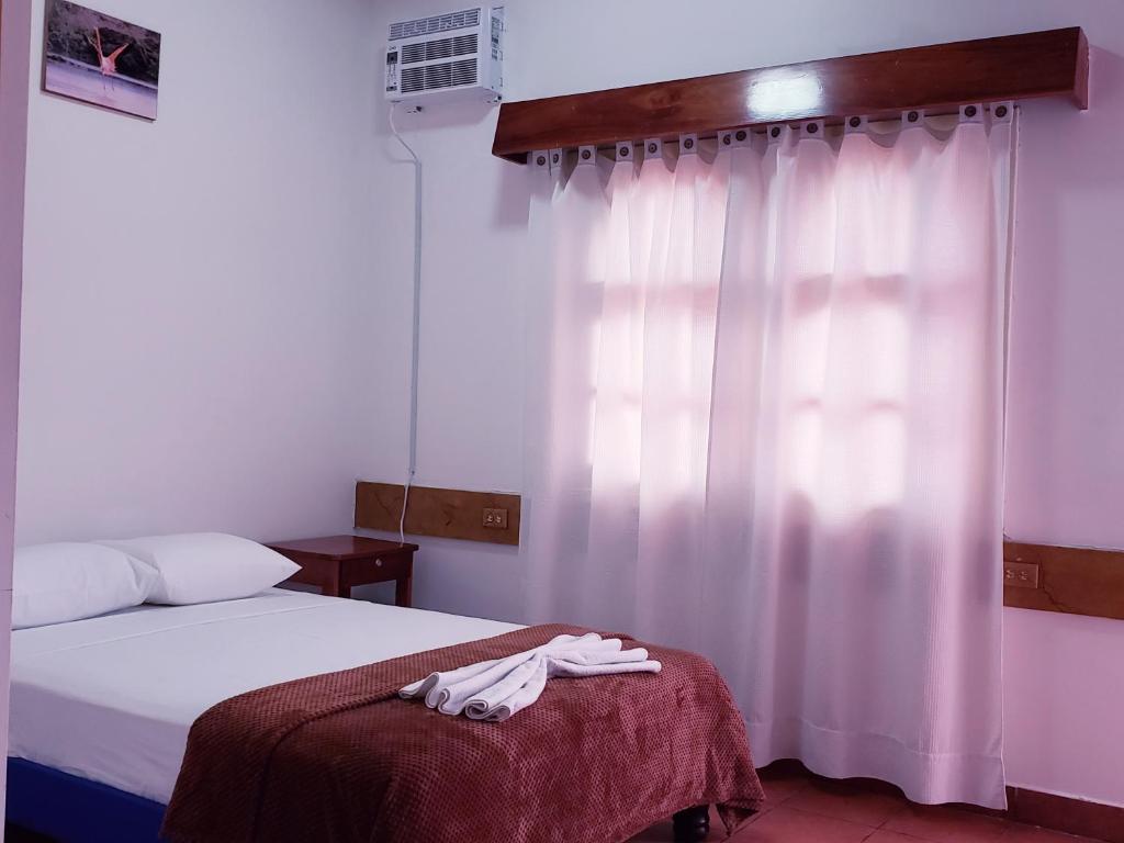 Postel nebo postele na pokoji v ubytování Hotel Crossman