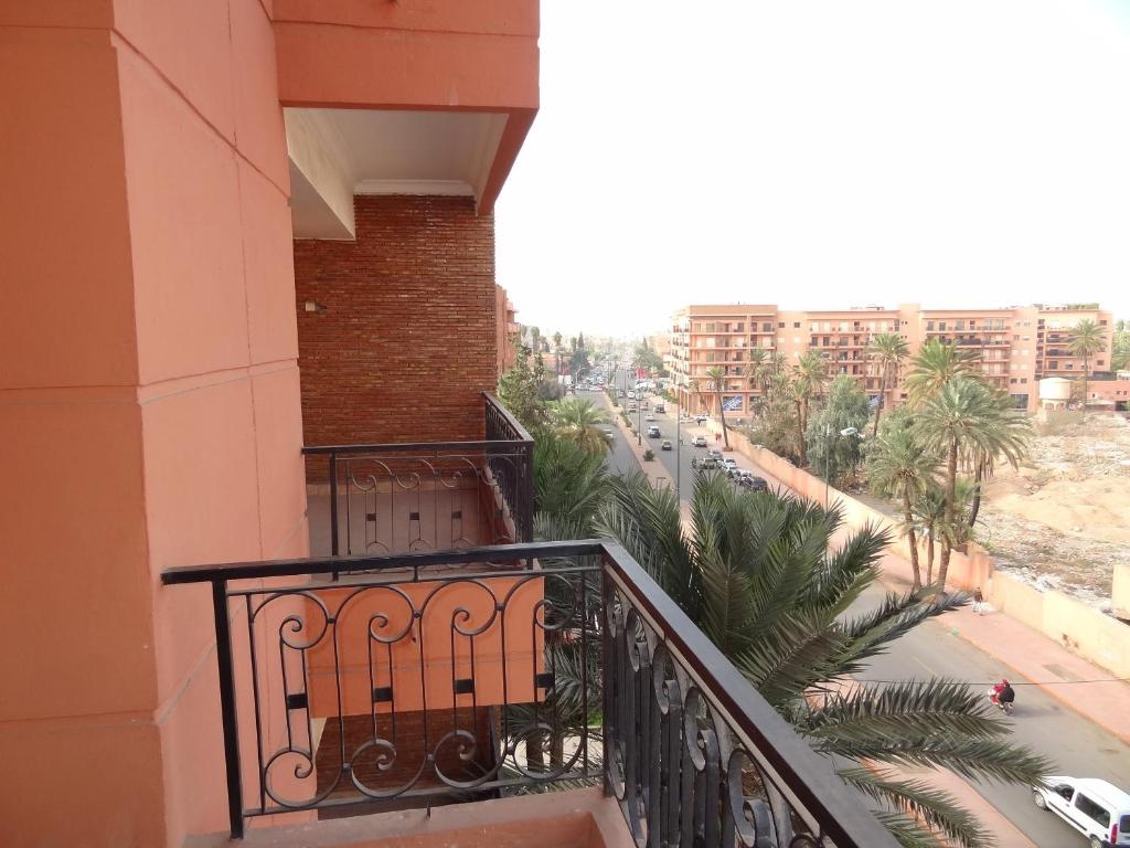 a balcony of a building with a view of a street at MCL Majorelle Appartement in Marrakesh