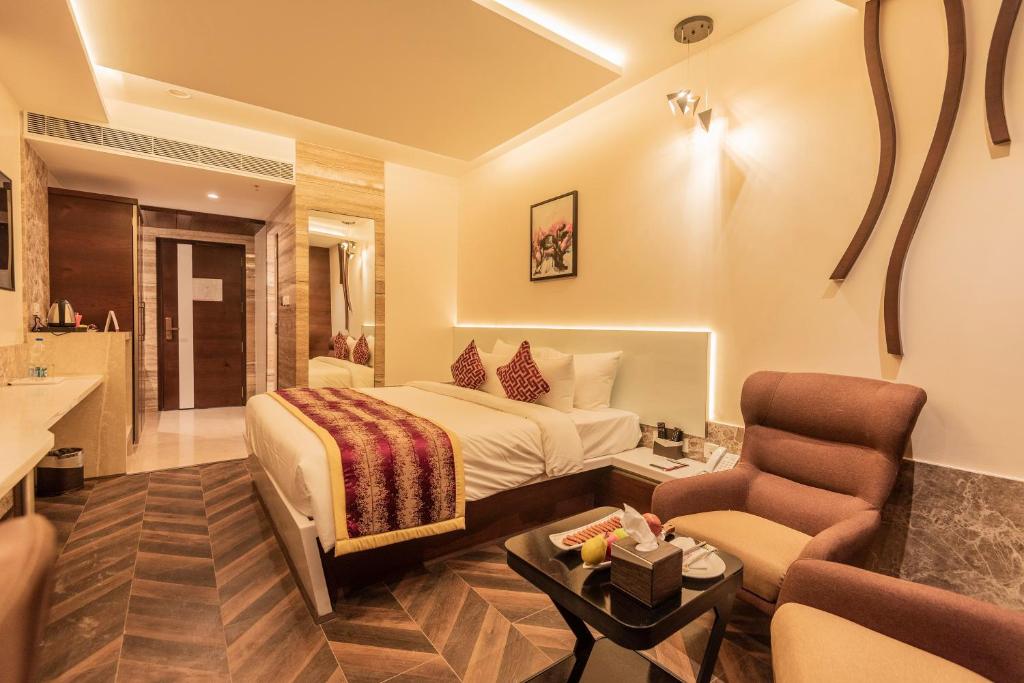 Postel nebo postele na pokoji v ubytování Hotel Park Elanza Coimbatore