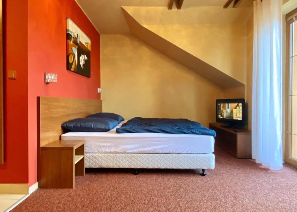 A bed or beds in a room at Apartment with beautiful view of High Tatras