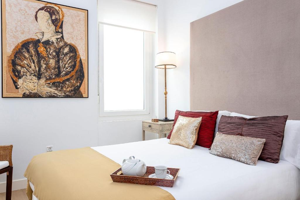 Postel nebo postele na pokoji v ubytování Genteel Home Julio César