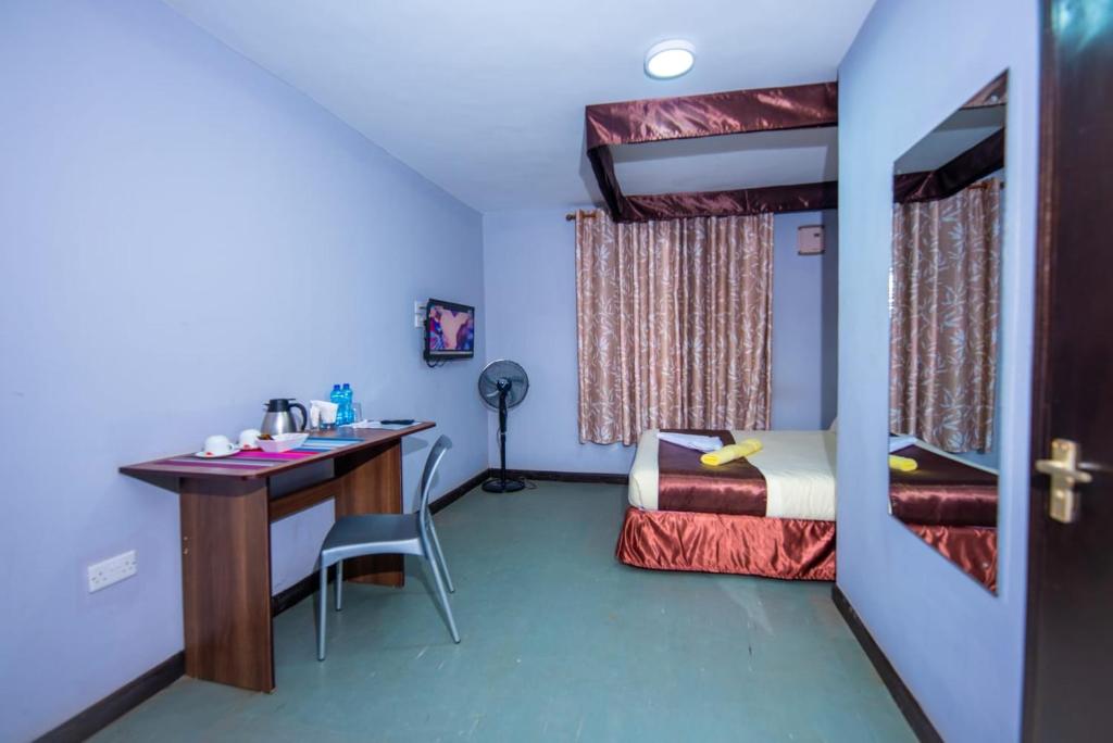 Postel nebo postele na pokoji v ubytování Kings Premier Inn