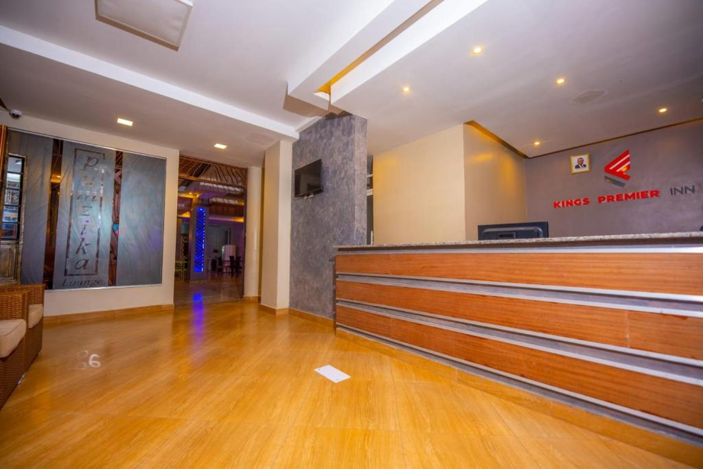 an empty courtroom with a cash counter in a building at Kings Premier Inn in Nairobi