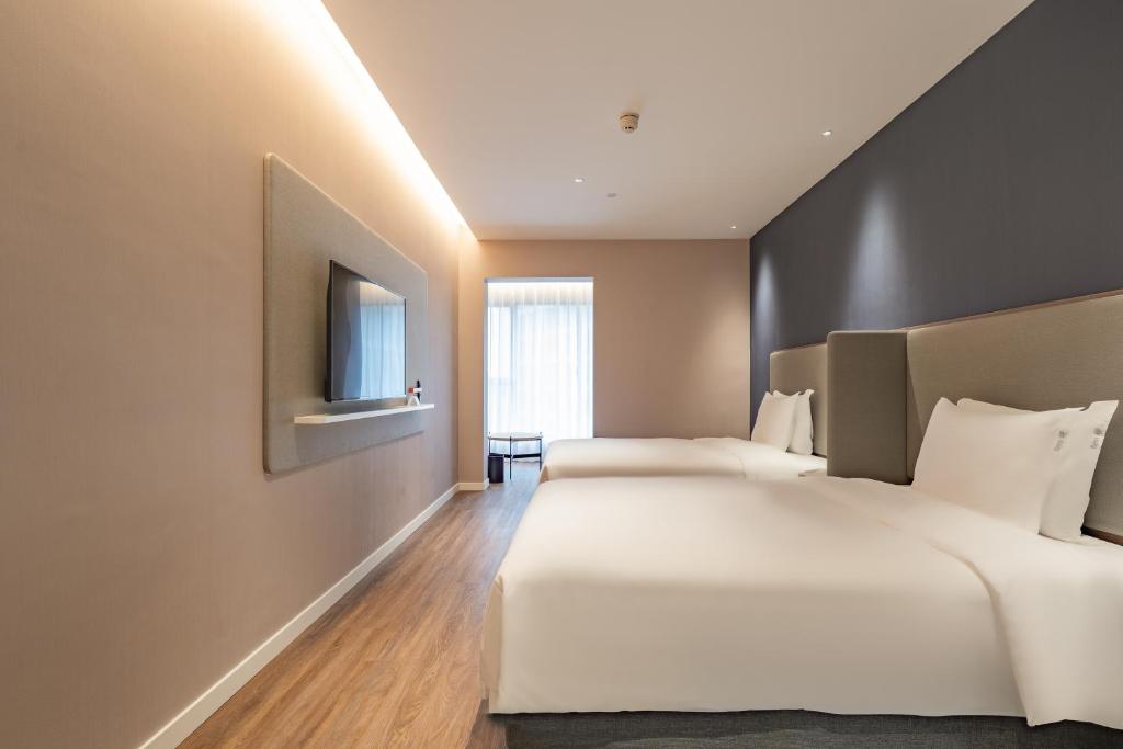 Postel nebo postele na pokoji v ubytování Holiday Inn Express Shanghai Expo Centre by IHG