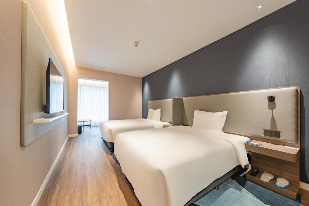 Postel nebo postele na pokoji v ubytování Holiday Inn Express Shanghai Expo Centre by IHG