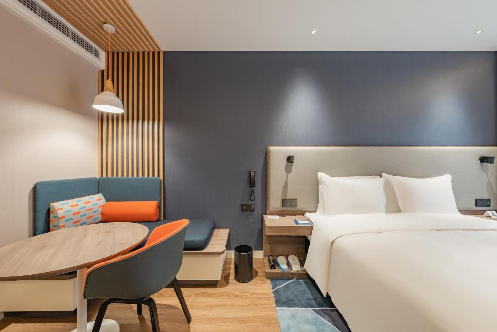 Postel nebo postele na pokoji v ubytování Holiday Inn Express Shanghai Expo Centre by IHG