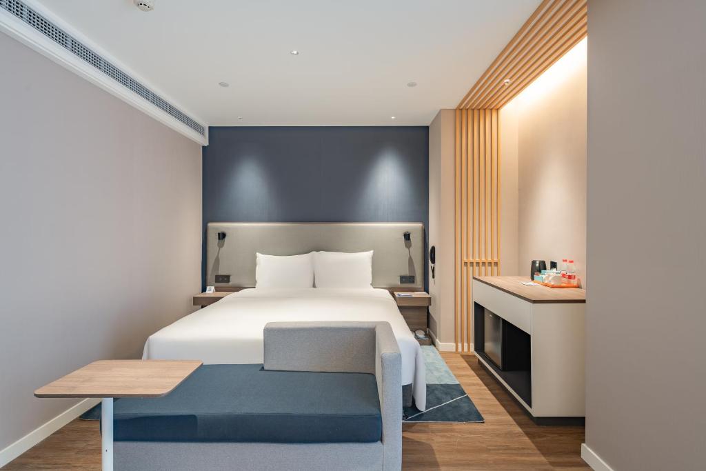 Postel nebo postele na pokoji v ubytování Holiday Inn Express Shanghai Expo Centre by IHG