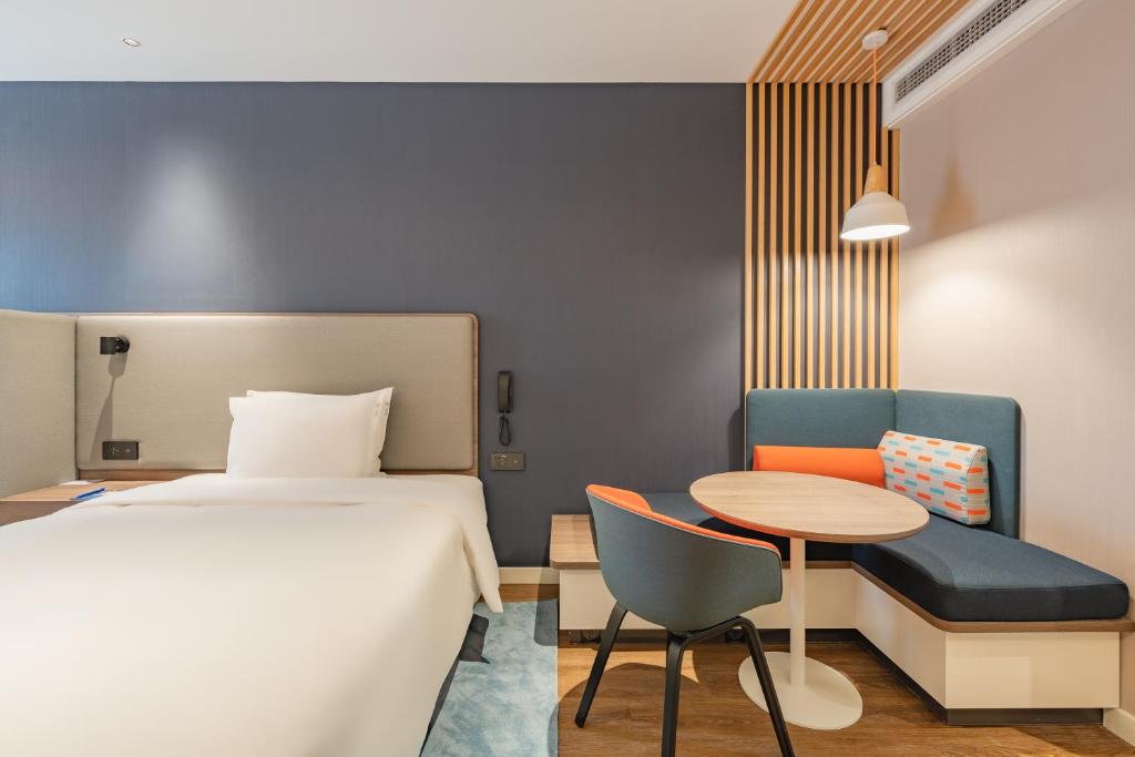 Postel nebo postele na pokoji v ubytování Holiday Inn Express Shanghai Expo Centre by IHG