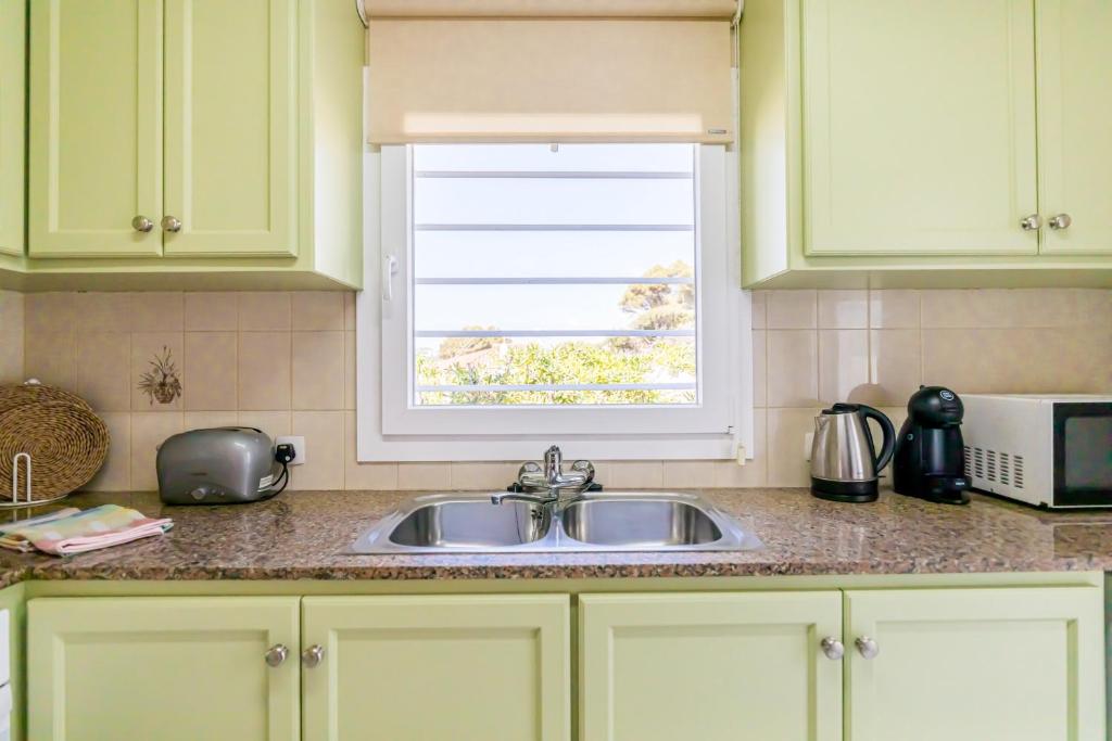 Kuchyň nebo kuchyňský kout v ubytování Villa Colors