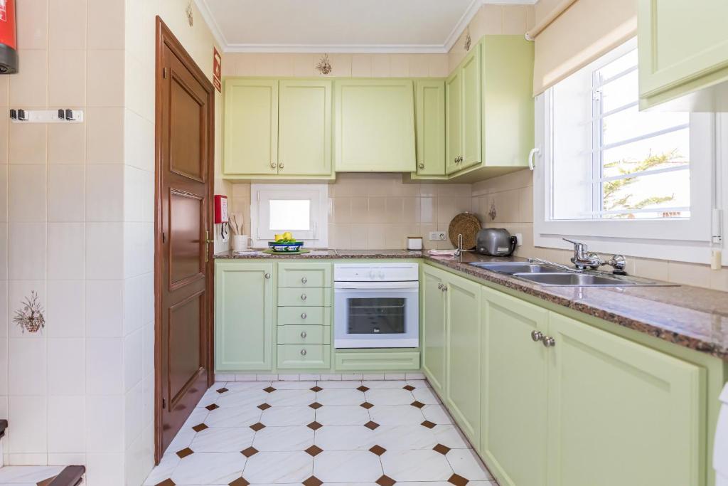 Kuchyň nebo kuchyňský kout v ubytování Villa Colors