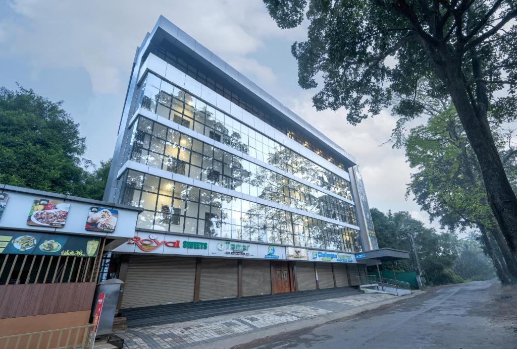 a large building with a lot of windows at Perumayan Arcade in Cochin