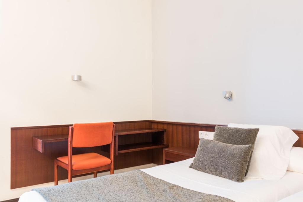 Posteľ alebo postele v izbe v ubytovaní Hotel Emporda