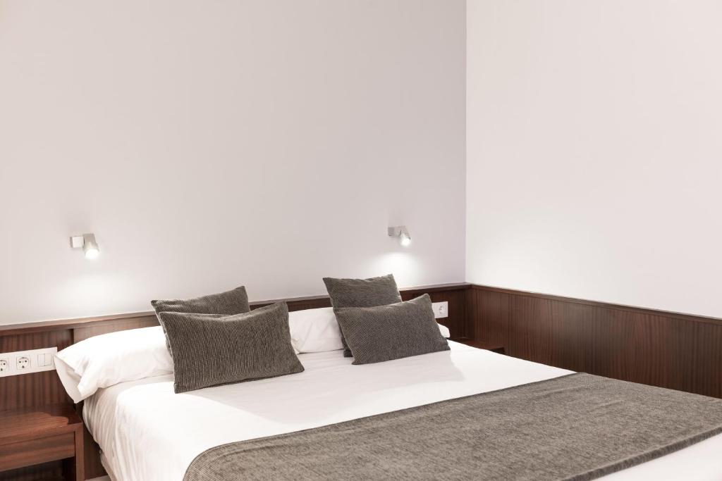 Posteľ alebo postele v izbe v ubytovaní Hotel Emporda