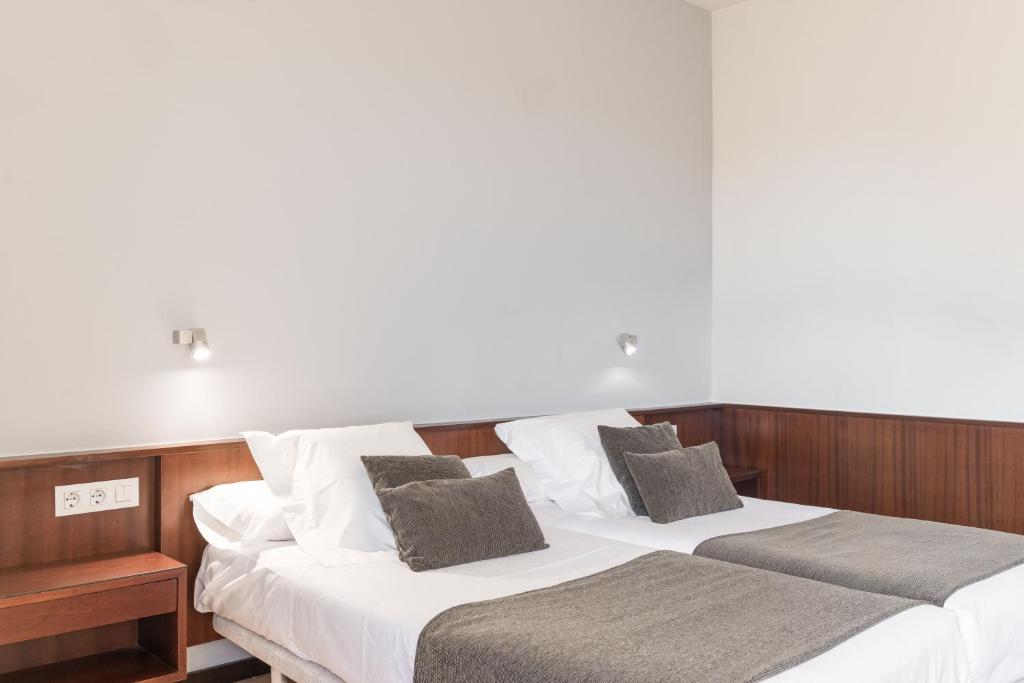 Posteľ alebo postele v izbe v ubytovaní Hotel Emporda