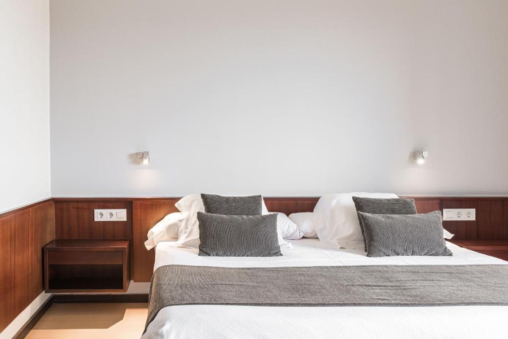 Posteľ alebo postele v izbe v ubytovaní Hotel Emporda