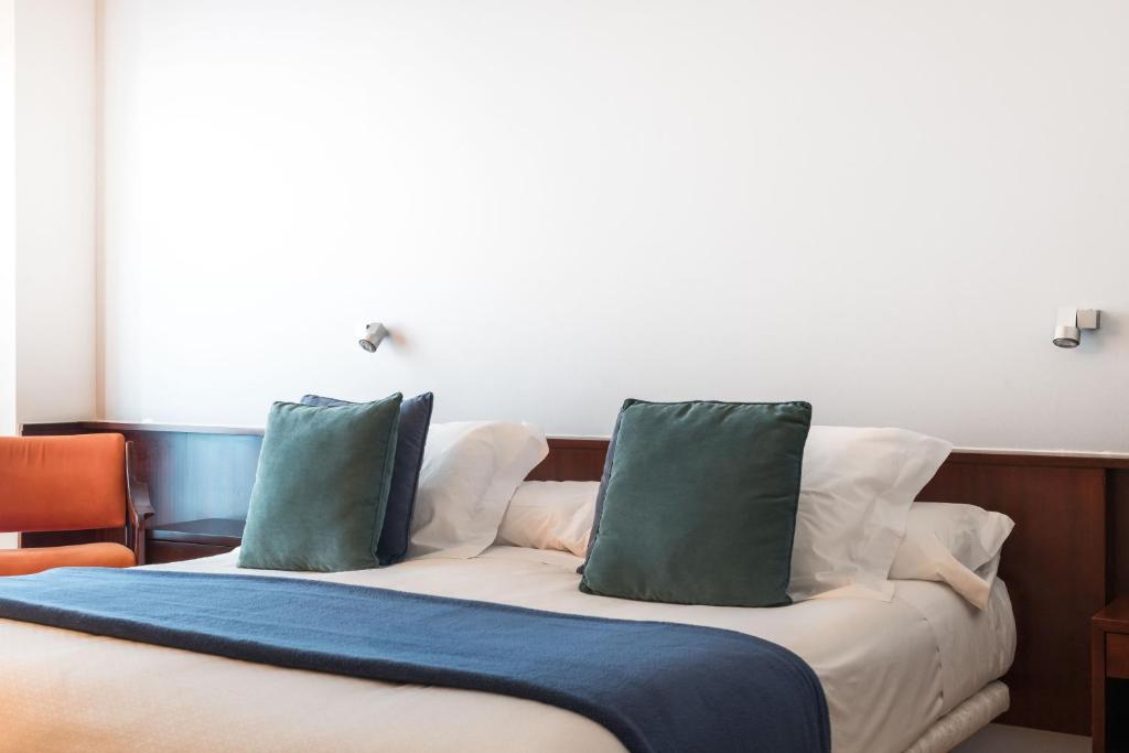 Posteľ alebo postele v izbe v ubytovaní Hotel Emporda