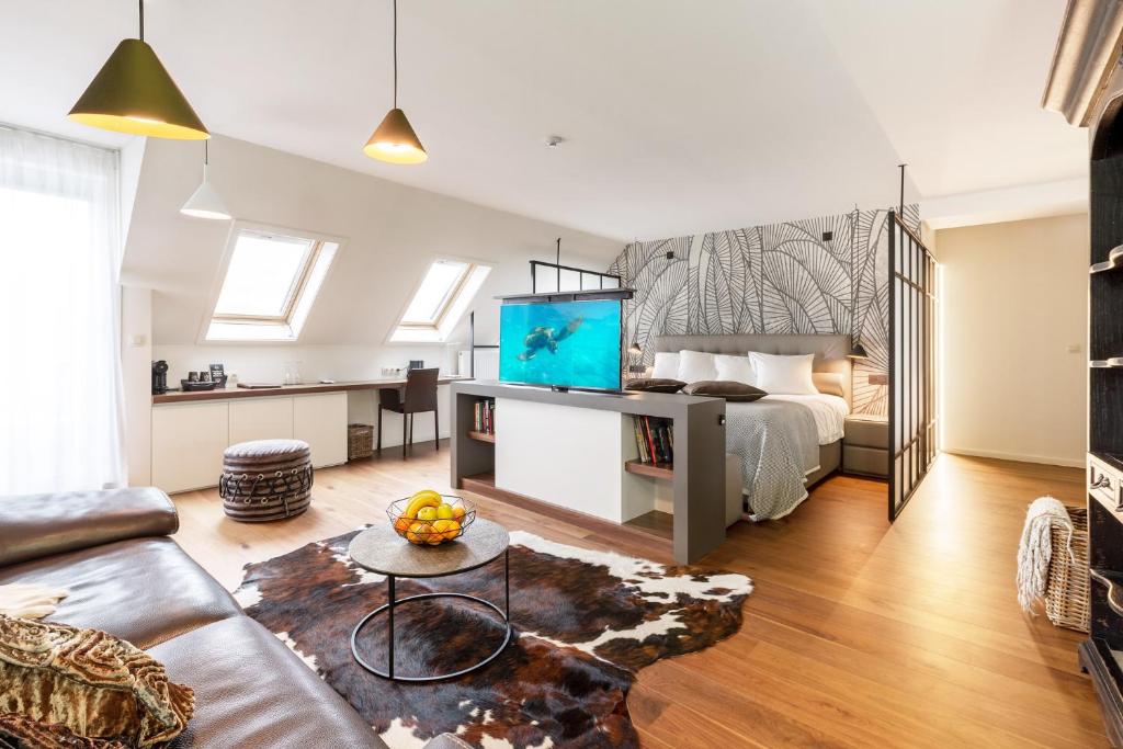 TV a/nebo společenská místnost v ubytování Cosmopolite Hotel Nieuwpoort-Bad