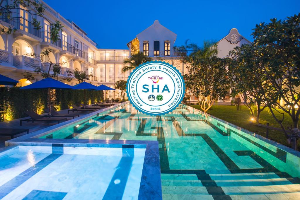 a pool at the shka resort and spa at Little Nyonya Hotel in Phuket